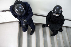 Two students from the Japan National Police Agency plan their method of completing their training scenario during Active Shooter Scenario training