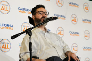 photo of Vance Taylor at microphone for California For All launch event