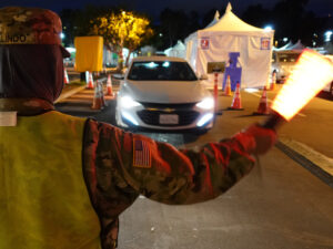 Soldier directs traffic at LA vaccination site