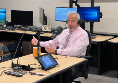 Budge Currier talks with Shawn Boyd at 911 test lab in Sacramento