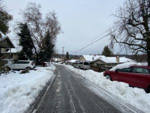 Snow on the ground in a neighborhood street