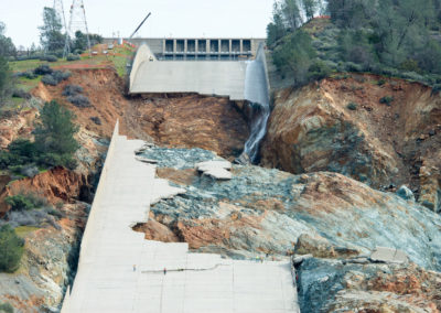 Workers inspect the damage at Oroville Dam flood control spillway, March 3, 2017.