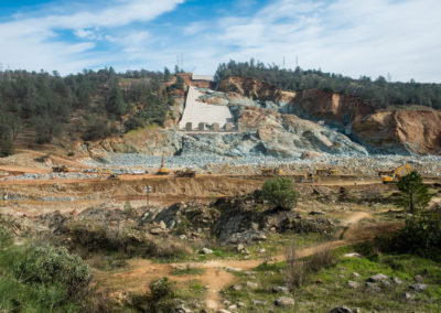 Contractors continue to remove sediment and debris below the Oroville Dam spillway in Oroville, California, on March 3, 2017. Work continues on the access roads and various eroded areas.
