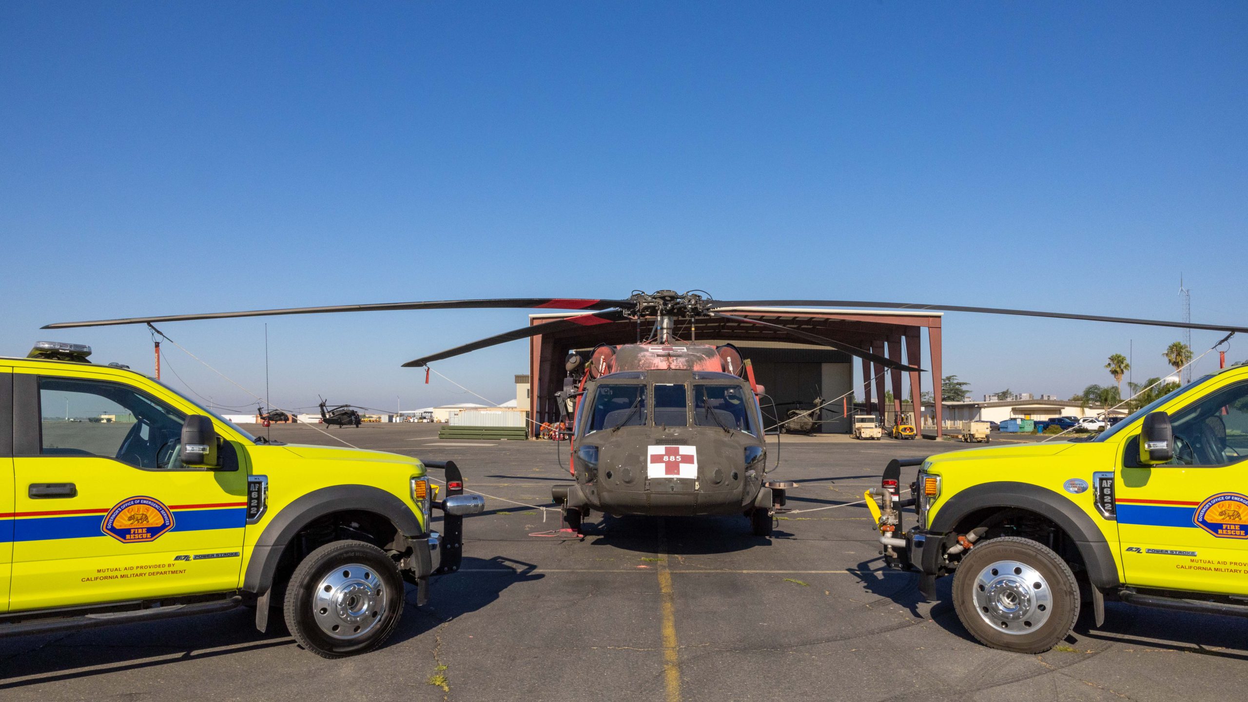 photo of OES engines next to a Blackhawk helicopter