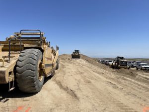 Heavy equipment on dirt overpass