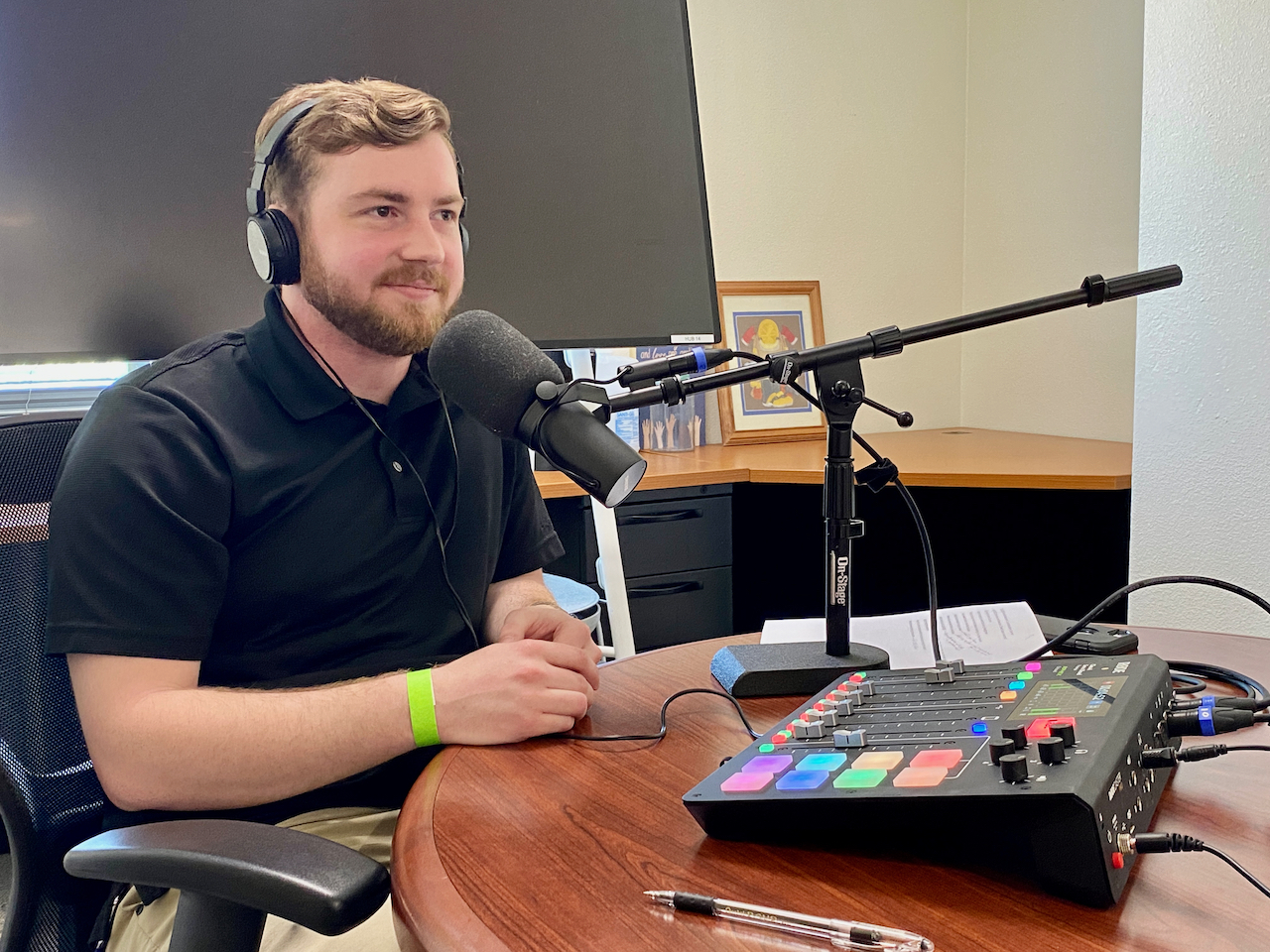 Adam Cranfill listens with recording equipment.