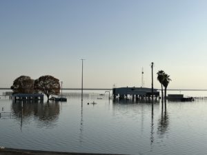 Image of Tulare Lake and farm buildings under water