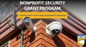 A photo of two security cameras on a brick wall. There's text overlayed reading, "Nonprofit Security Grant Program" and "To enhance safety in nonprofit and faith-based communities."