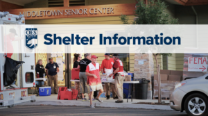 Text says Shelter information. Image of people wearing red vests in front of a community center