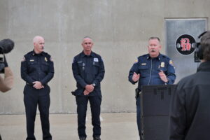 The photo shows Cal OES Fire and Rescue Chief, Brian Marshall, speaking at the opening event in Roseville. The photo also features representatives from the Roseville Fire Department and the Union Pacific Railroads team. 