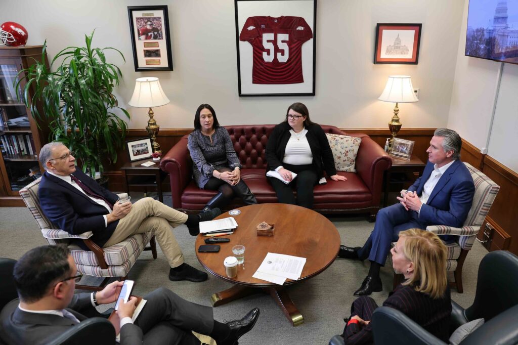 Room of people talking with governor newsom